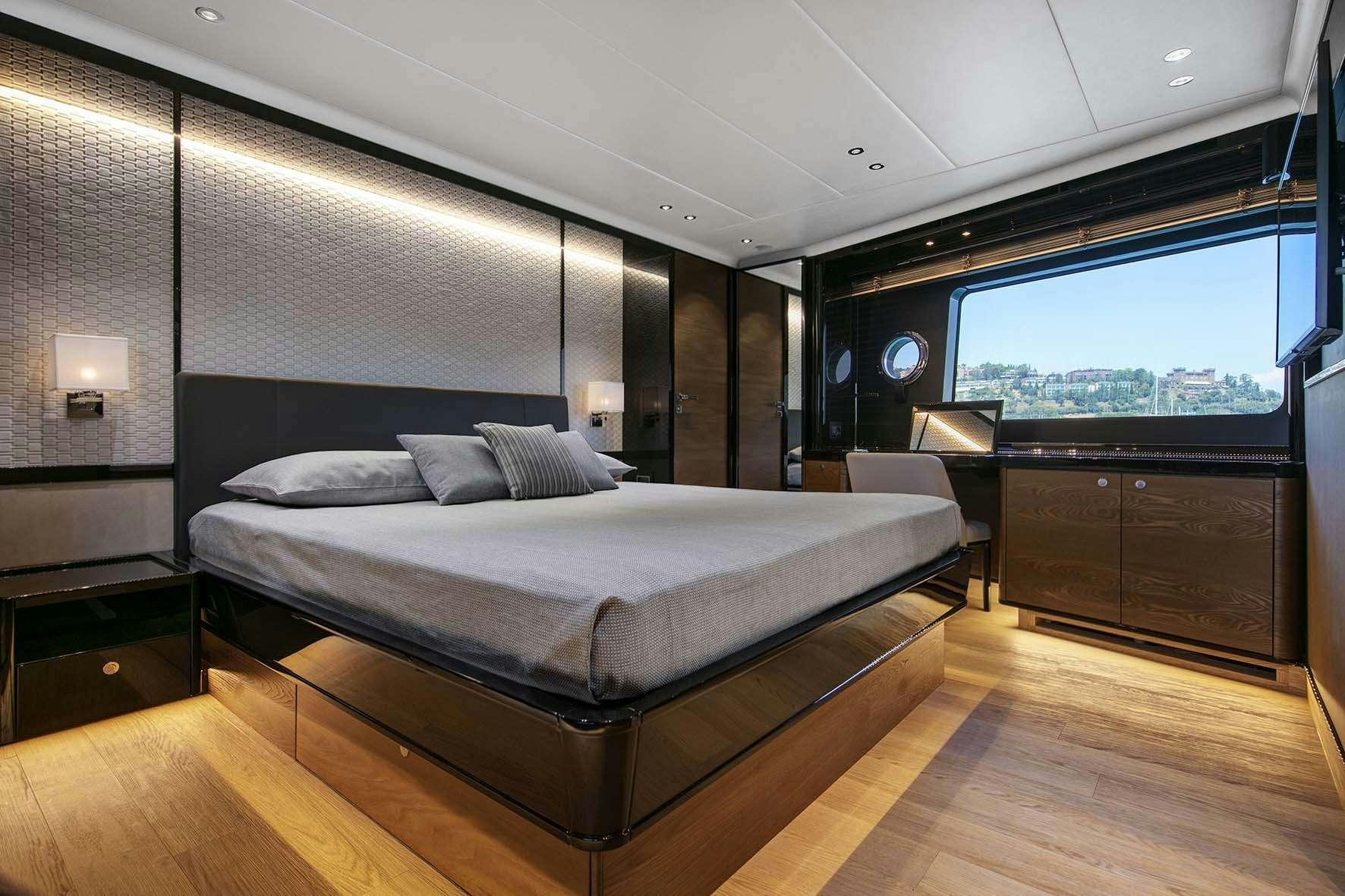 a large bed in a room aboard ENIGMA Yacht for Charter