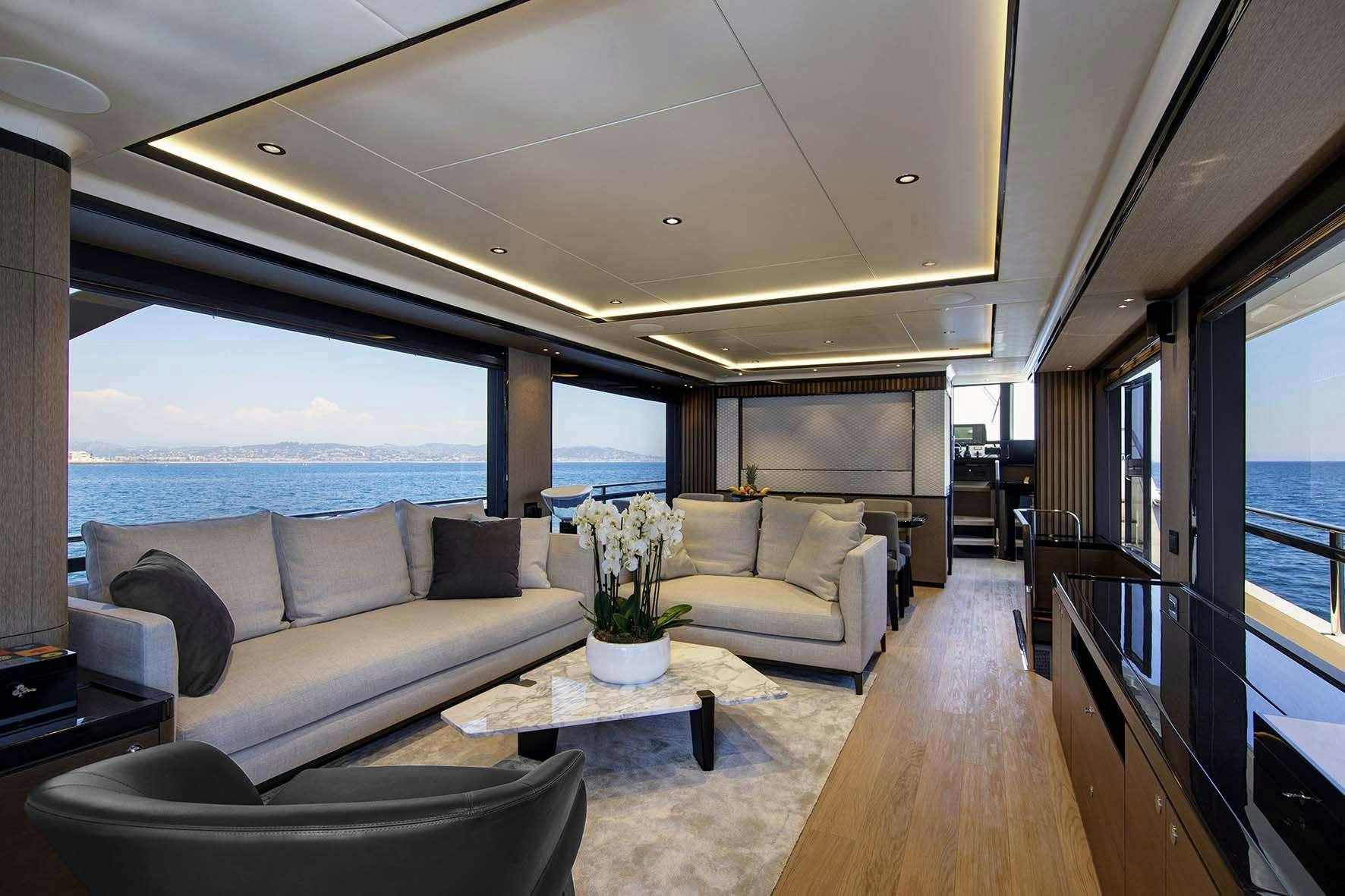 a living room with a large window aboard ENIGMA Yacht for Charter