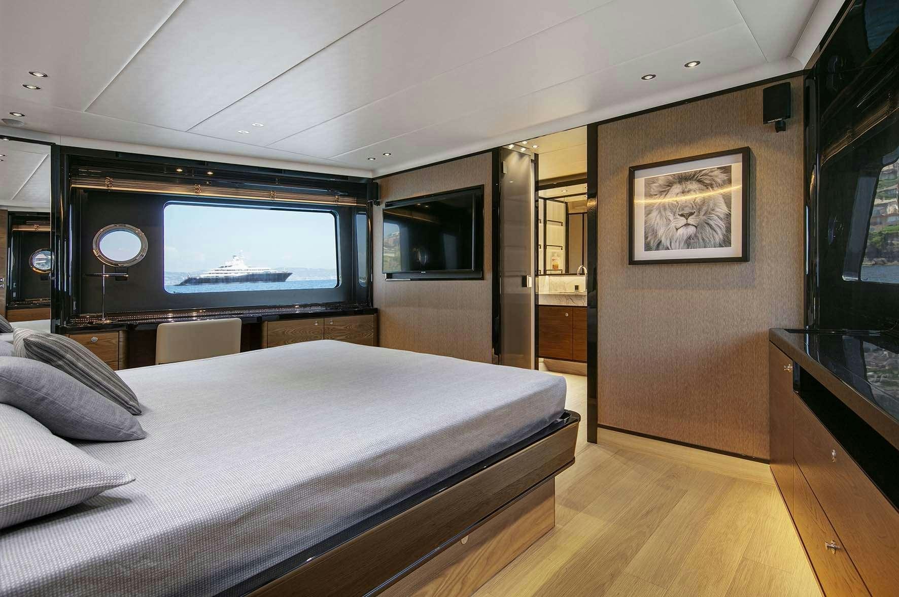 a bed in a room aboard ENIGMA Yacht for Charter