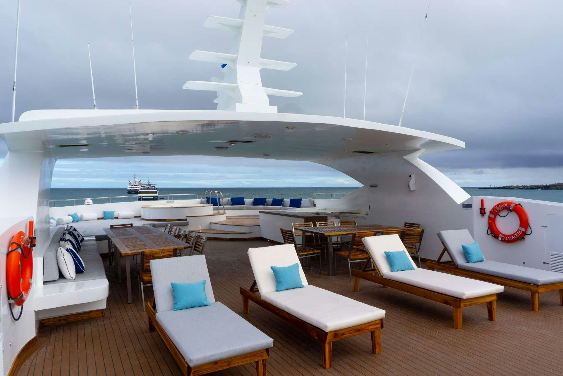 a room with a large ship in it aboard INFINITY Yacht for Charter