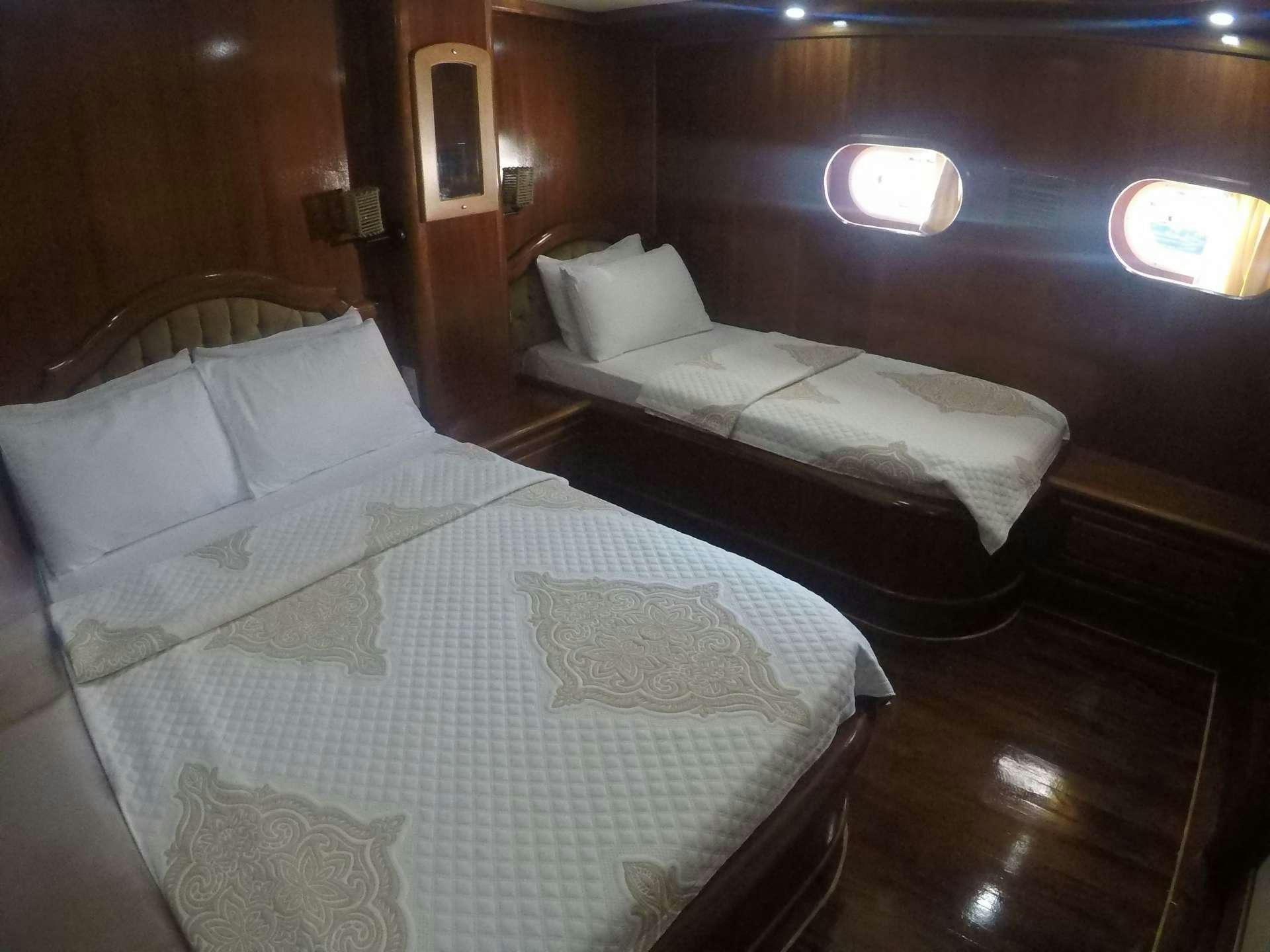 a room with two beds aboard PRENSES BUGCE Yacht for Charter