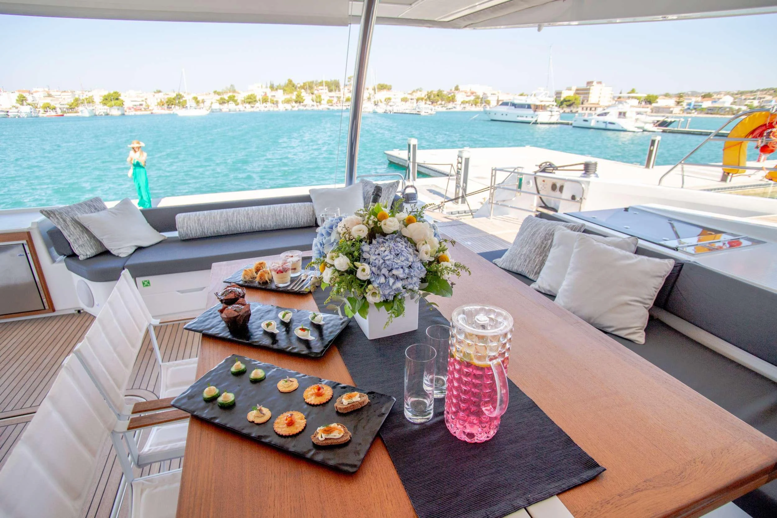 a table with food and drinks on it aboard CHRISTAL MIO Yacht for Charter