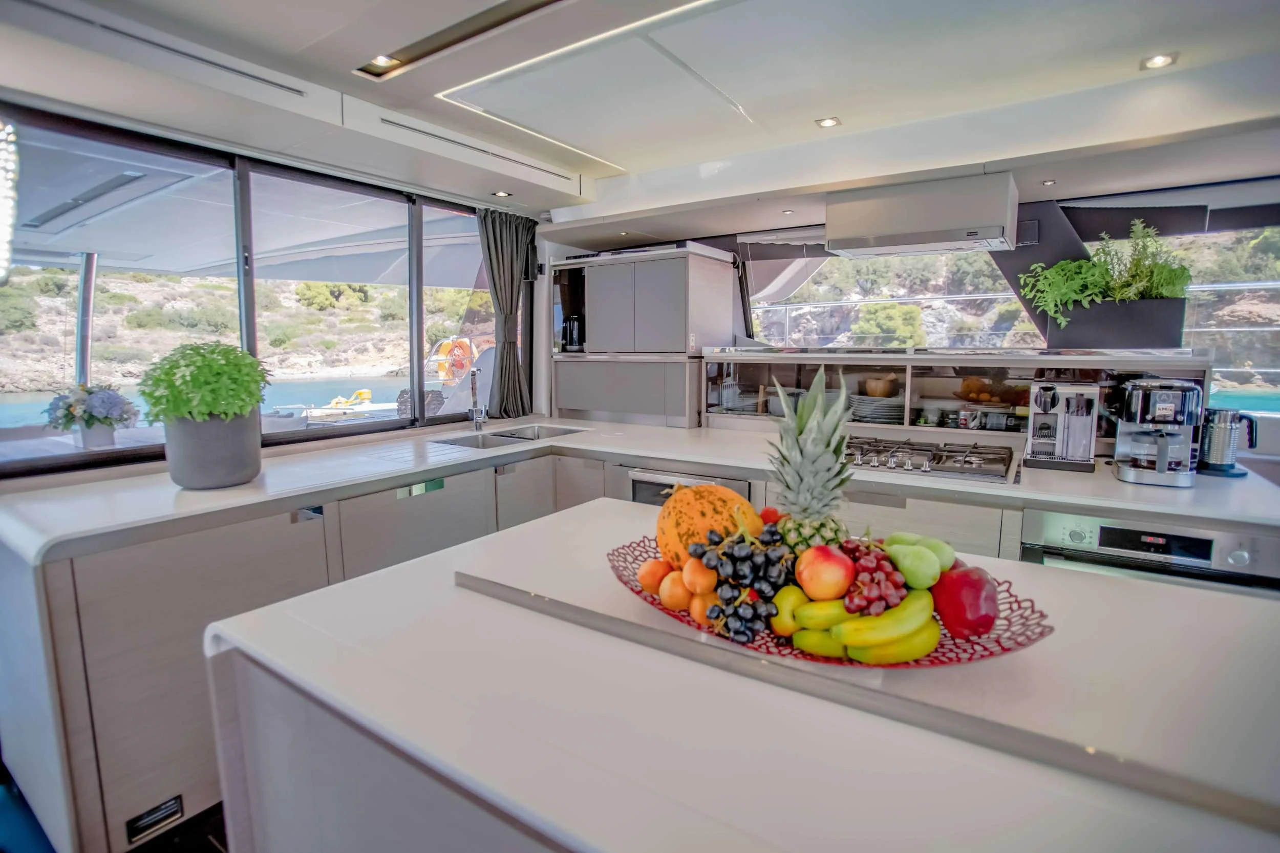 a kitchen with a large window aboard CHRISTAL MIO Yacht for Charter