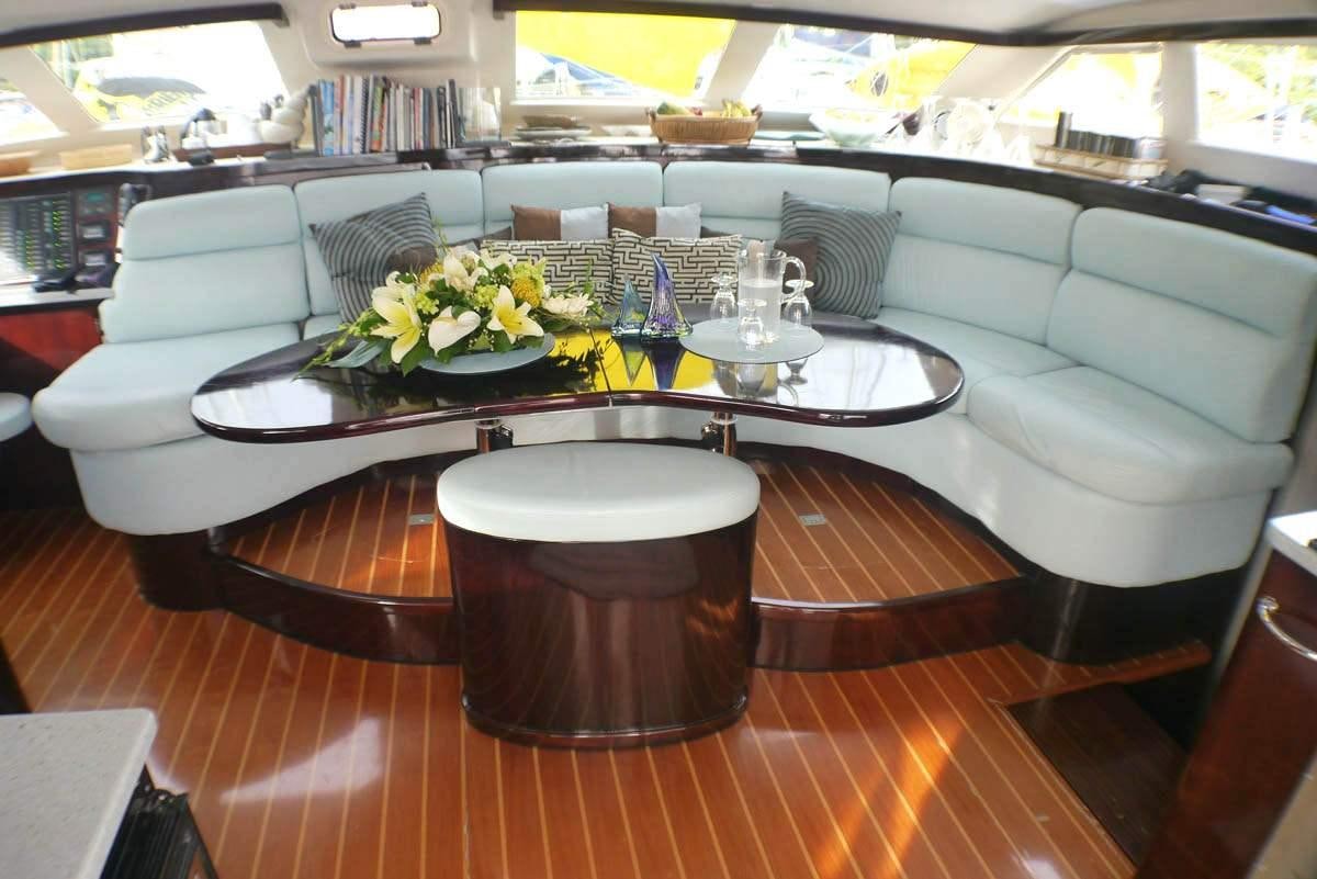 a table with a set of plates and glasses on it aboard NUTMEG Yacht for Charter
