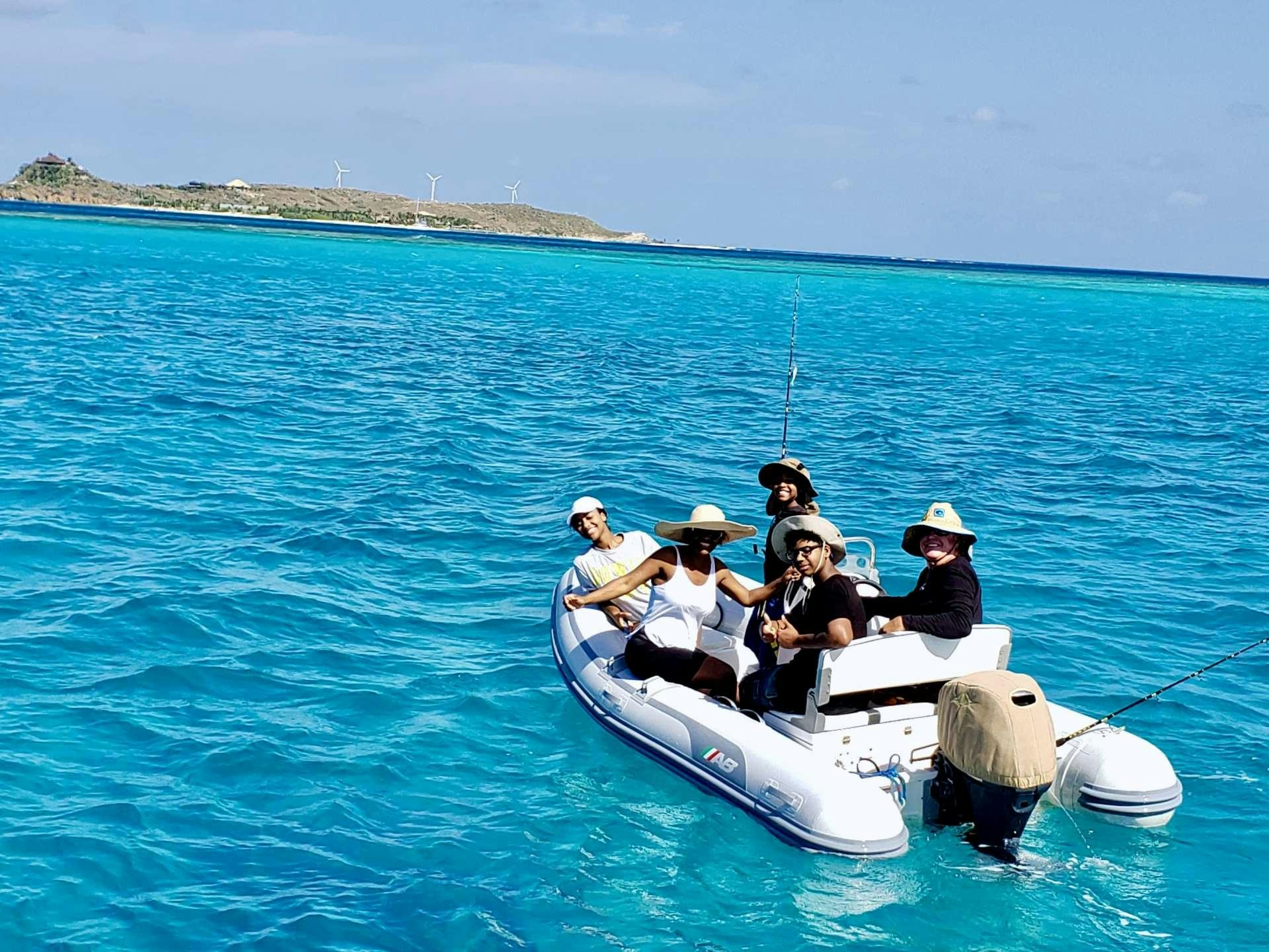 a group of people in a boat aboard NUTMEG Yacht for Charter