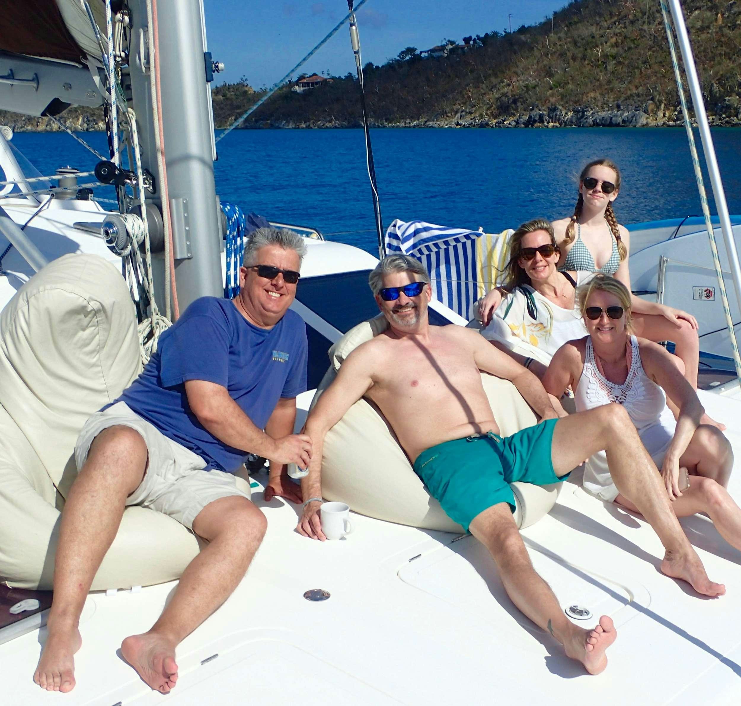 a group of people on a boat aboard NUTMEG Yacht for Charter