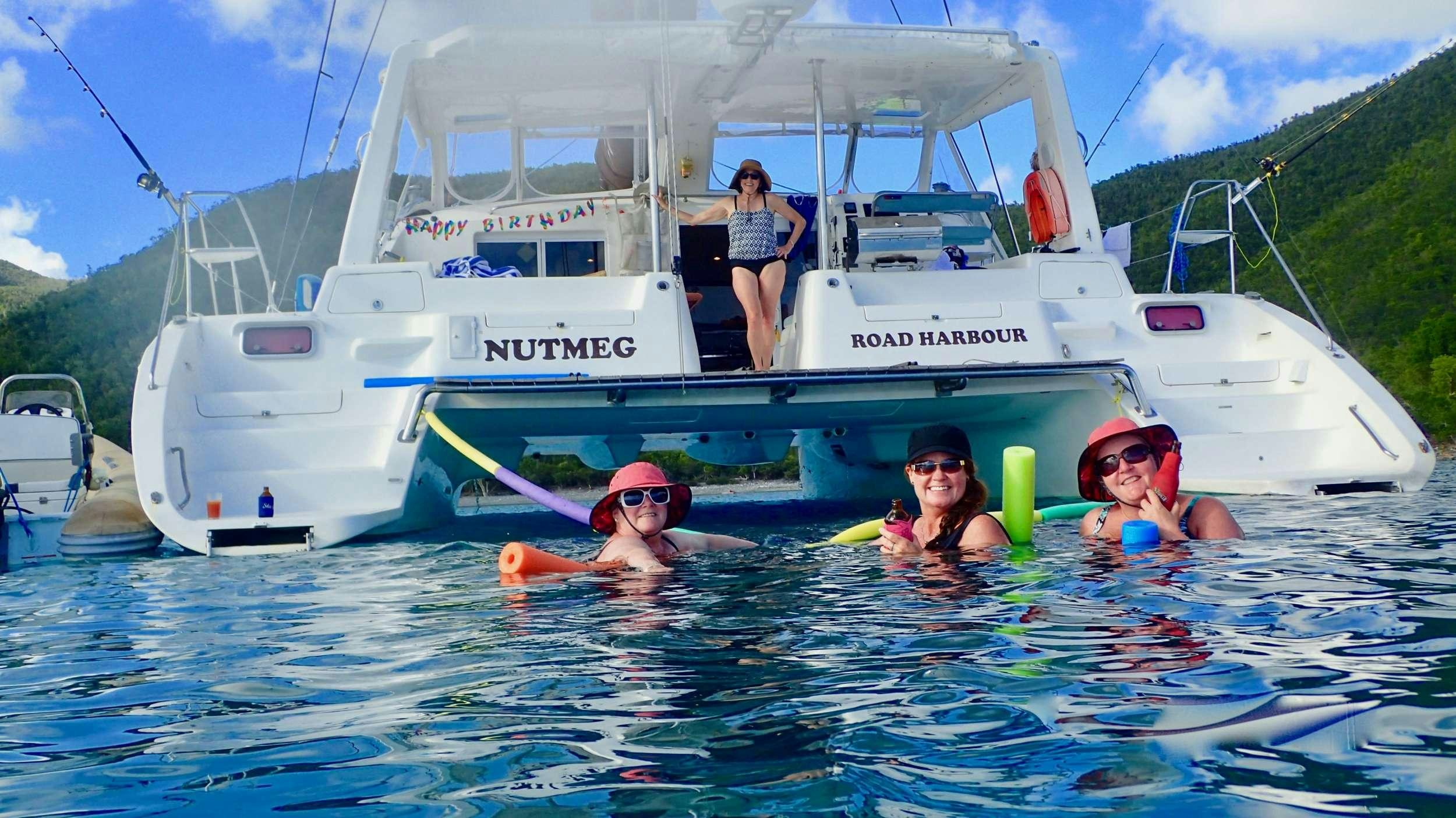 a group of people in a pool aboard NUTMEG Yacht for Charter