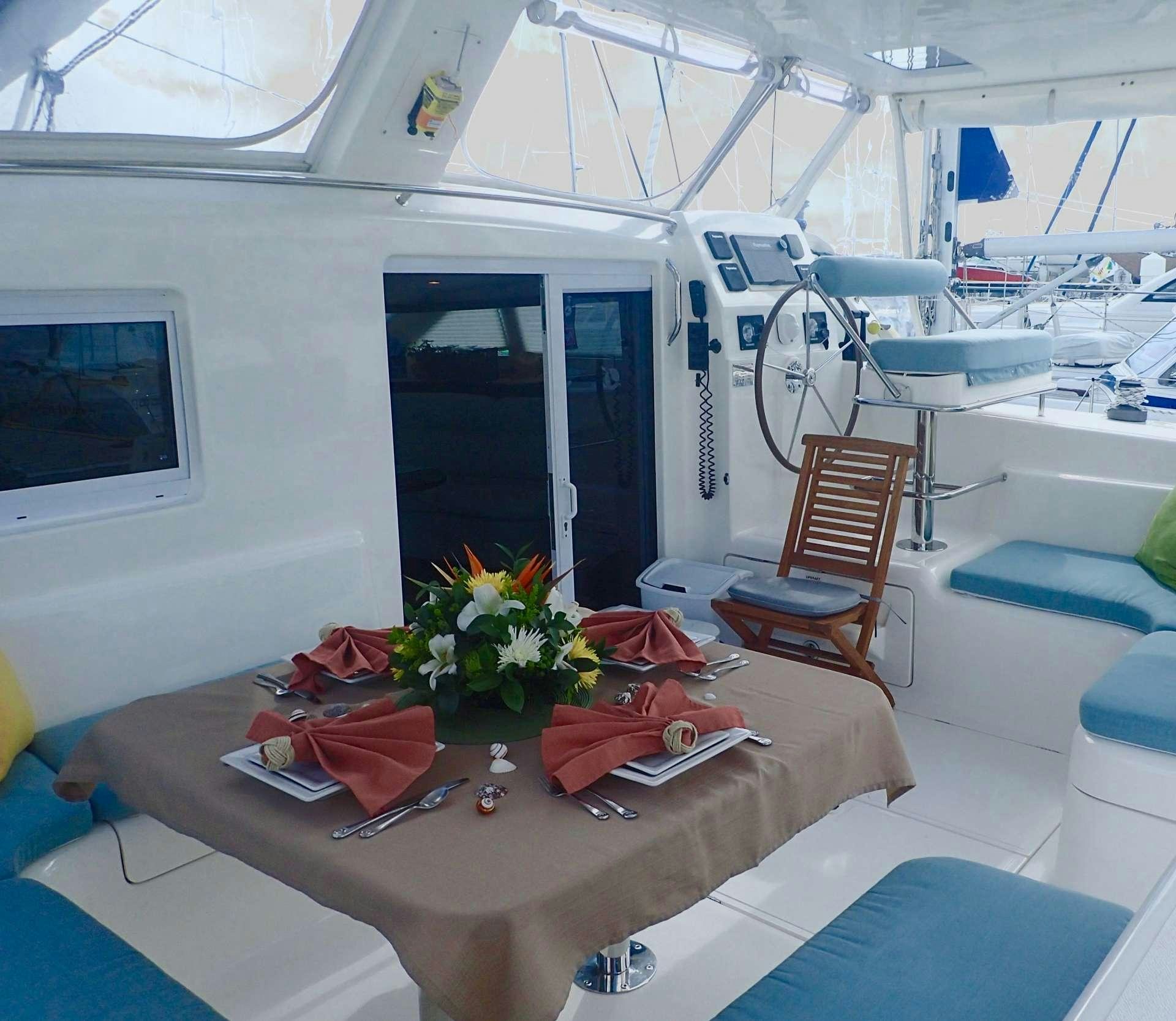 a room with a table and chairs aboard NUTMEG Yacht for Charter