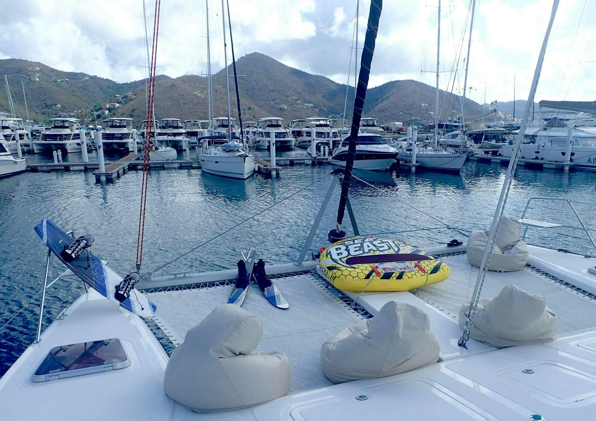 a group of boats in a harbor aboard NUTMEG Yacht for Charter