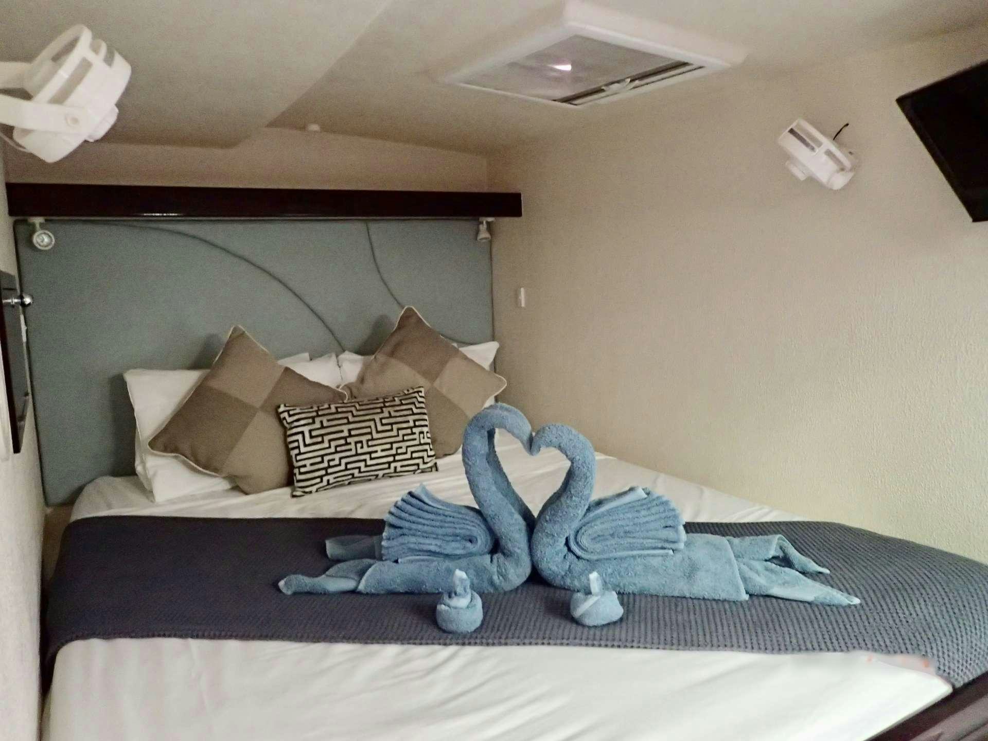 a stuffed toy on a bed aboard NUTMEG Yacht for Charter