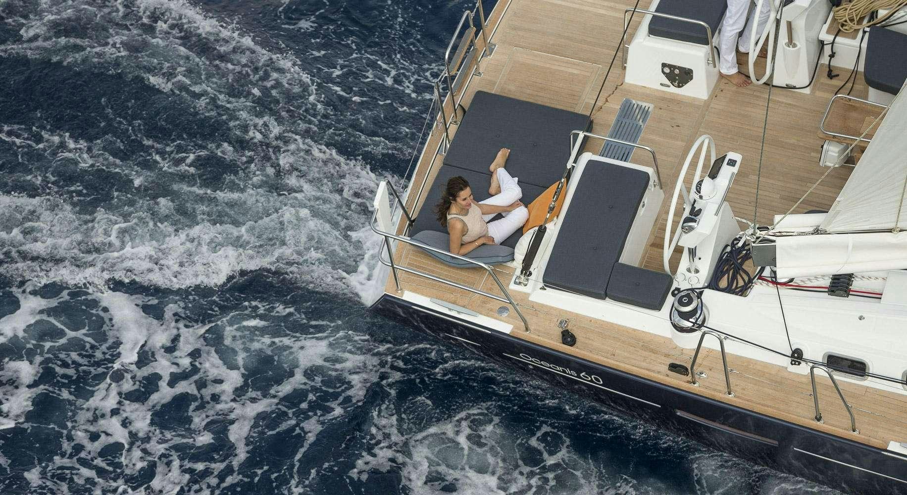 a person sitting on a boat aboard OCEAN STAR Yacht for Charter