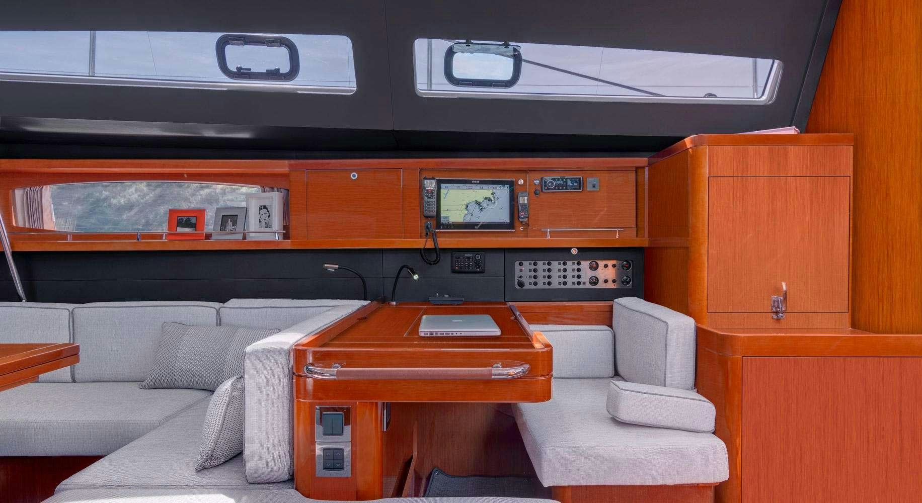 a room with a couch and a desk aboard OCEAN STAR Yacht for Charter