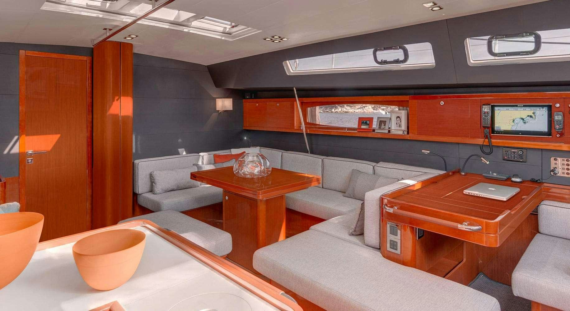 a room with couches and a table aboard OCEAN STAR Yacht for Charter
