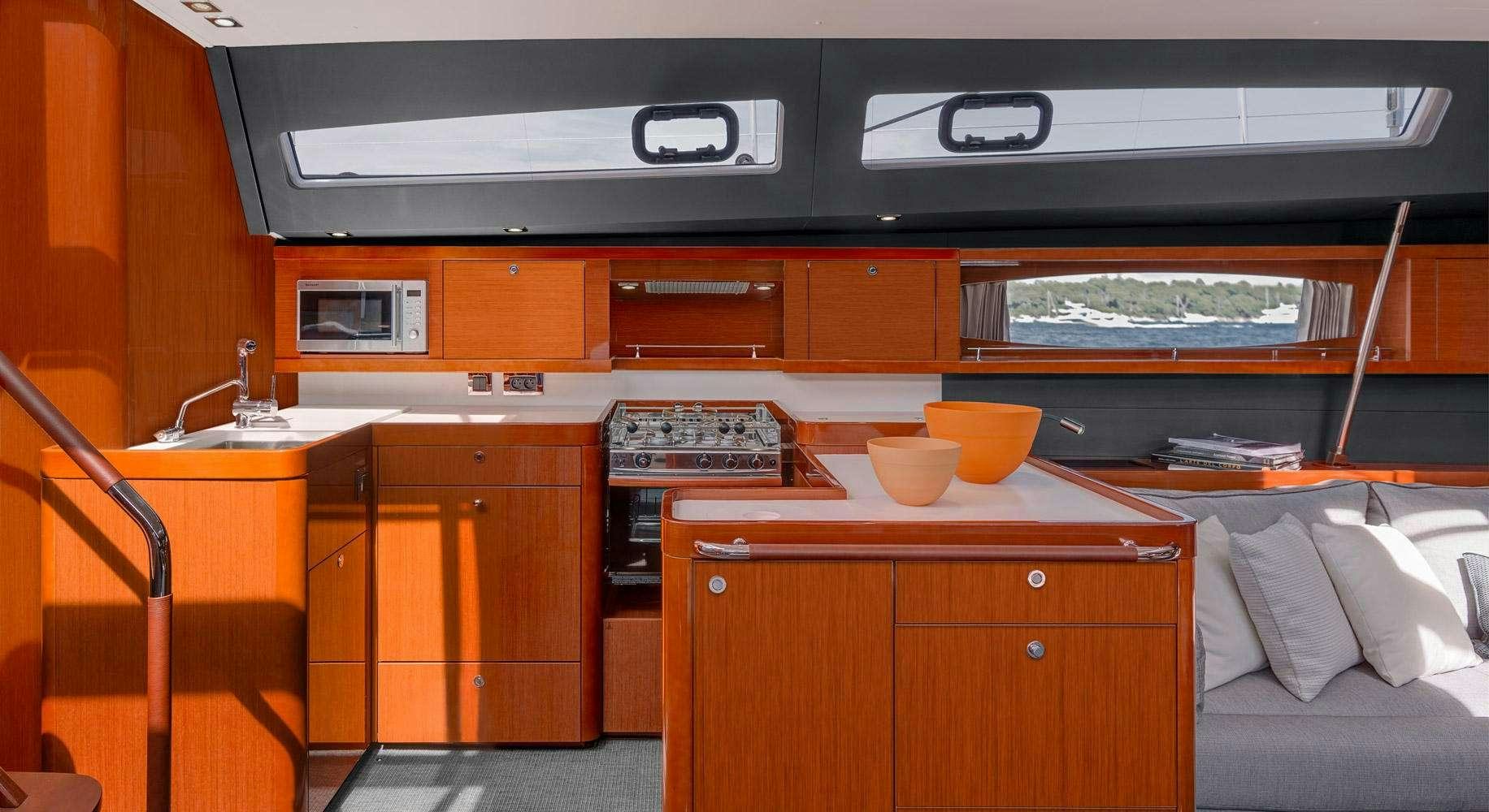 a kitchen with a stove and cabinets aboard OCEAN STAR Yacht for Charter