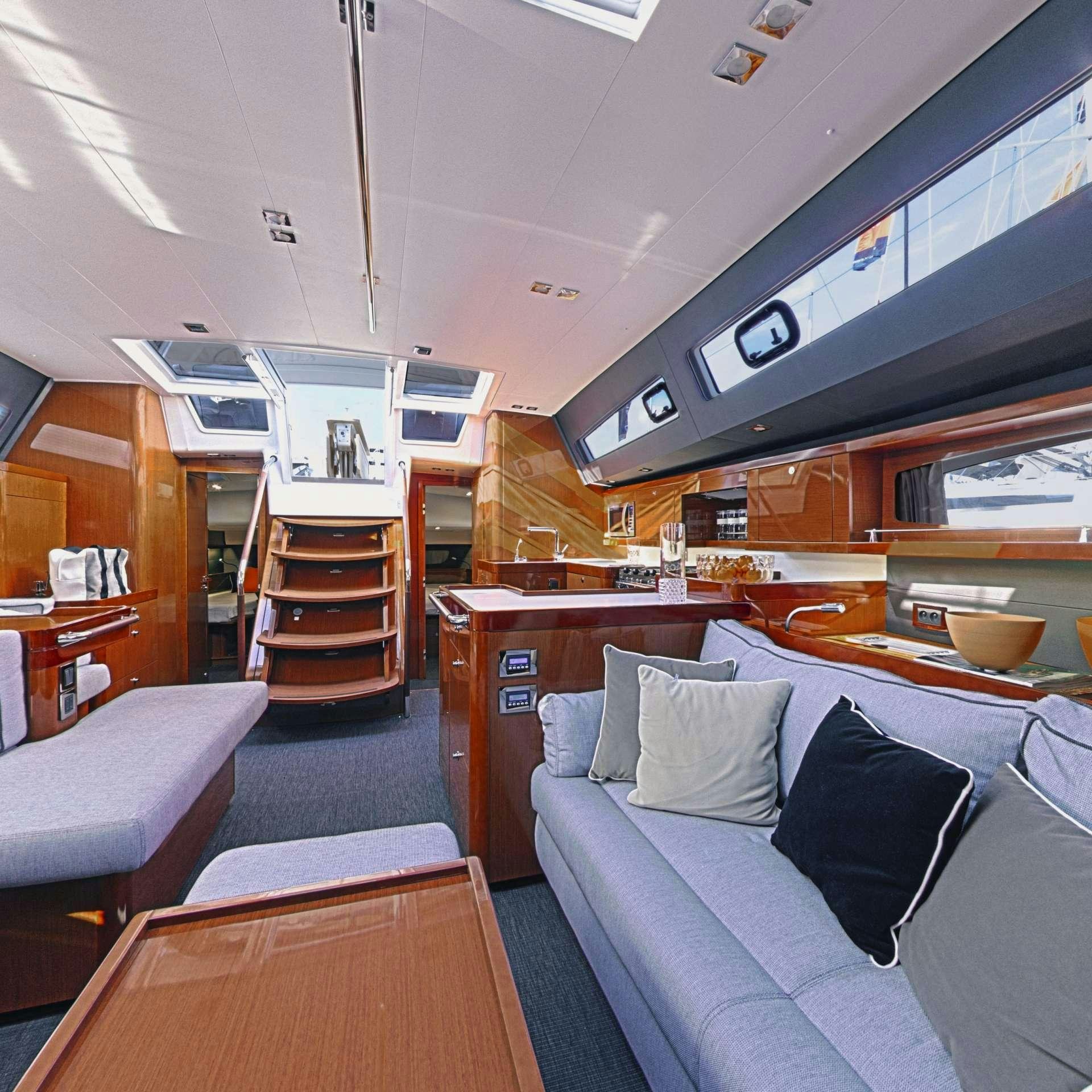 a room with a bed and a couch aboard OCEAN STAR Yacht for Charter