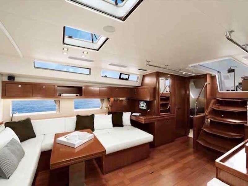 a room with a bed and a tv on the wall aboard SIRIUS Yacht for Charter