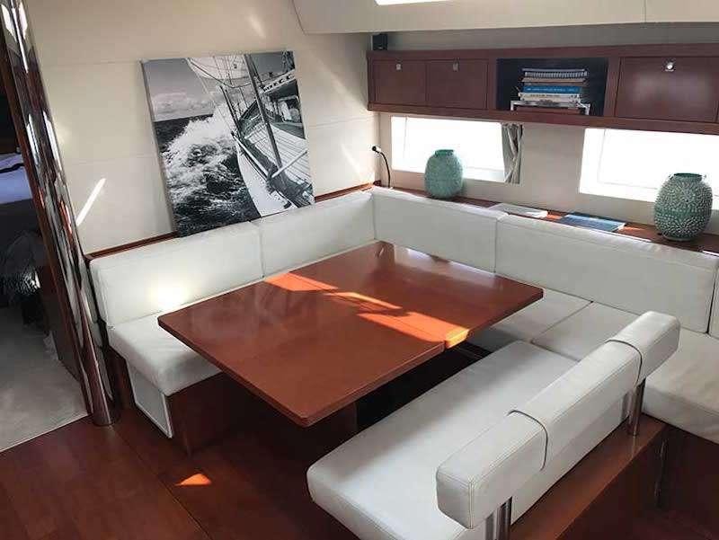 a room with a table and chairs aboard SIRIUS Yacht for Charter