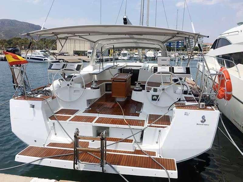 a boat docked at a pier aboard SIRIUS Yacht for Charter