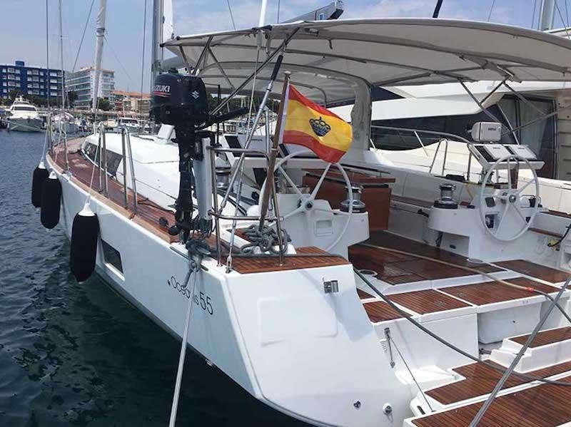 a boat with a flag on it aboard SIRIUS Yacht for Charter