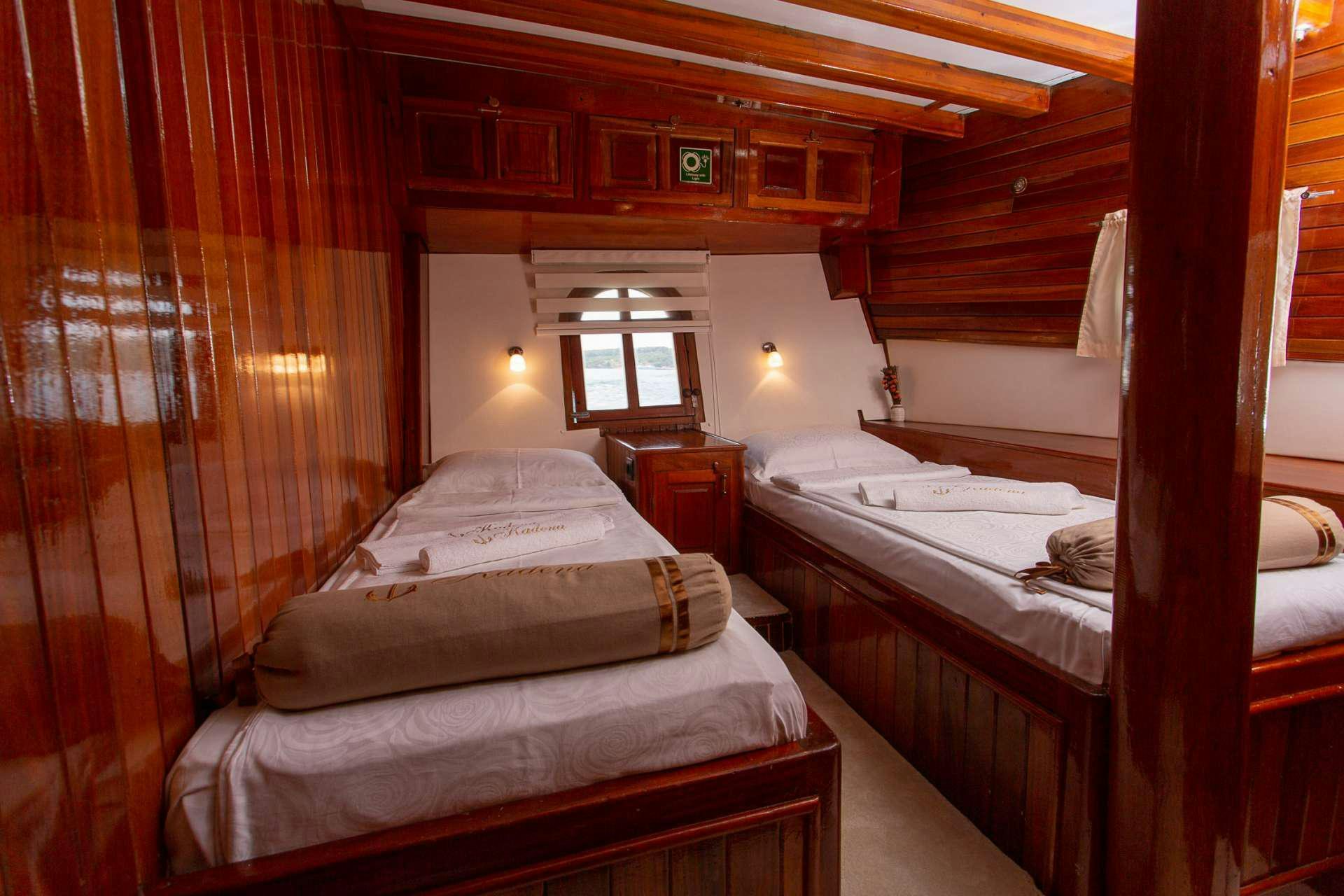 a couple of beds in a cabin aboard KADENA Yacht for Charter