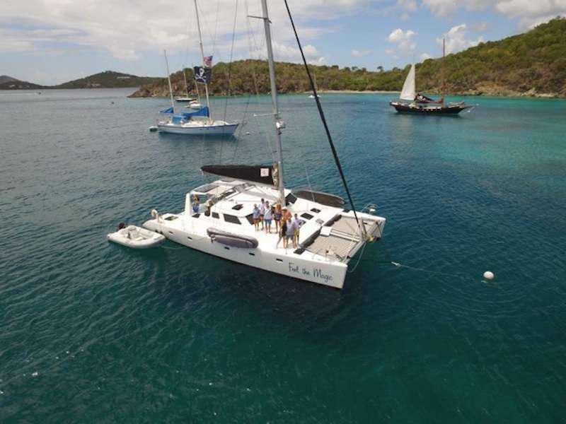 a group of people on a sailboat in the water aboard FEEL THE MAGIC Yacht for Charter