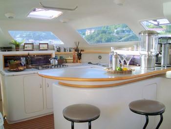a kitchen with a large island aboard FEEL THE MAGIC Yacht for Charter
