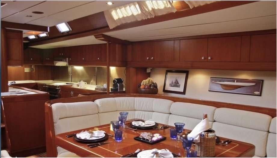 a room with a table and chairs aboard ASPIRATION Yacht for Charter