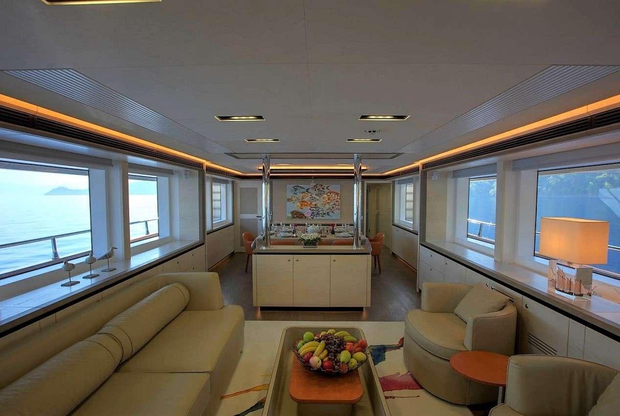a living room with a large window aboard ARCHSEA Yacht for Charter