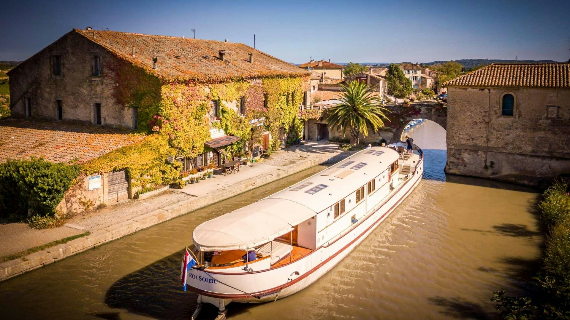 a boat on a river aboard ROI SOLEIL Yacht for Charter