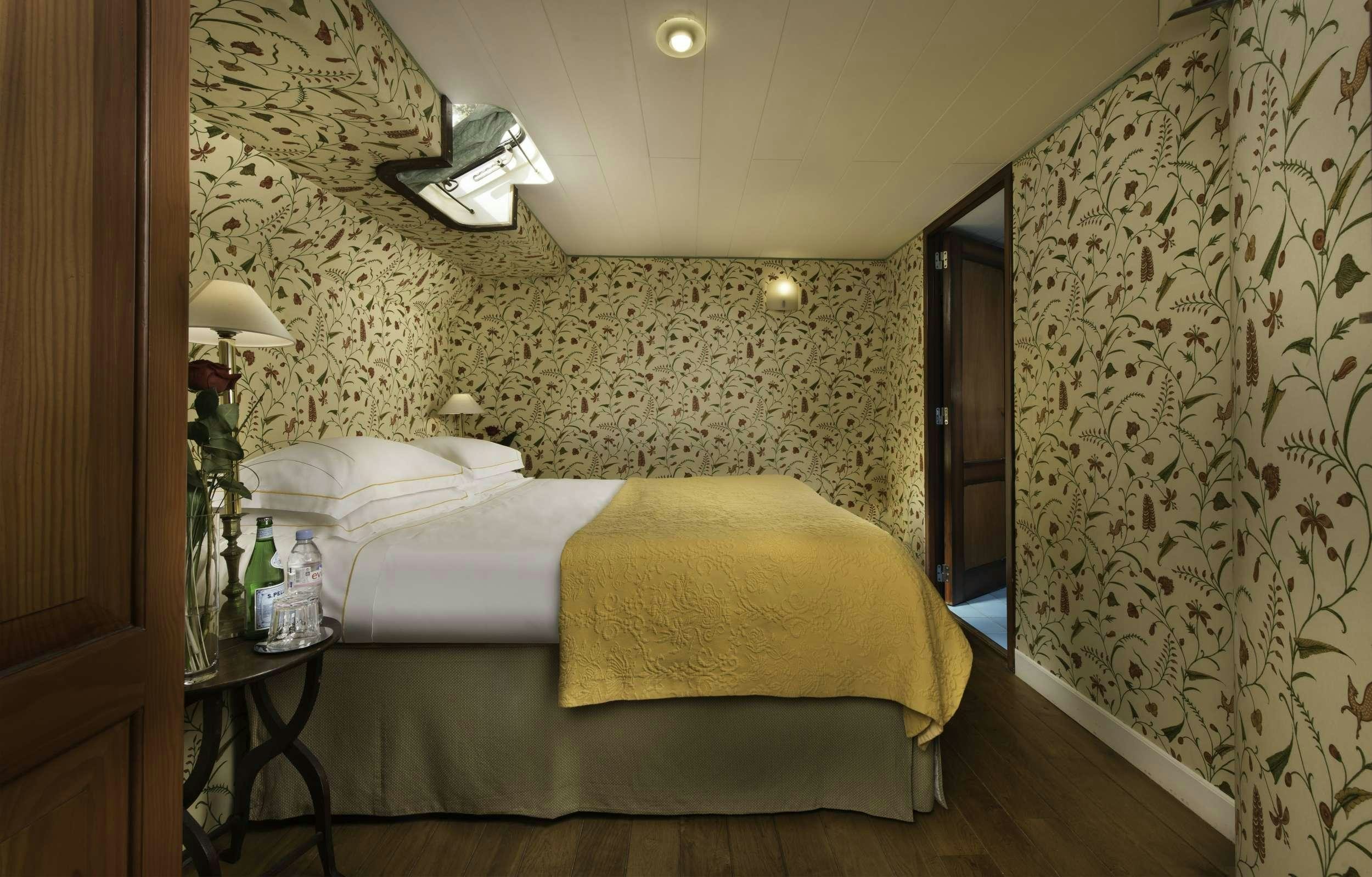 a bed in a room aboard ROI SOLEIL Yacht for Charter