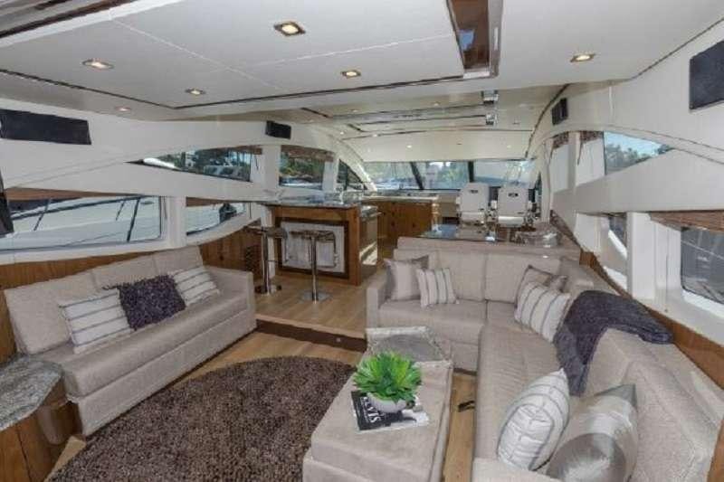 a room with a couch and a coffee table aboard BETTER BOAT Yacht for Charter