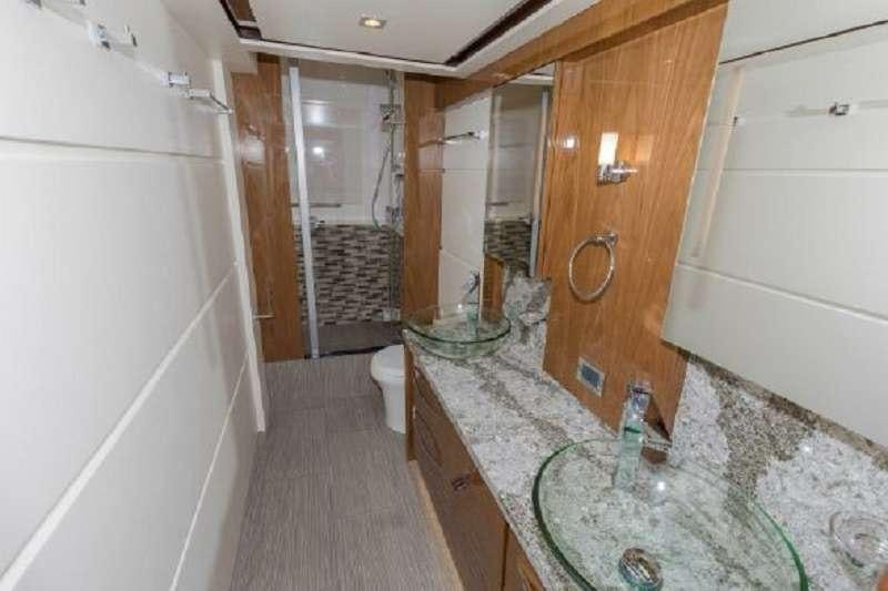 a bathroom with marble counter tops aboard BETTER BOAT Yacht for Charter