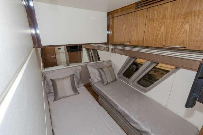 a bed with a white sheet aboard BETTER BOAT Yacht for Charter