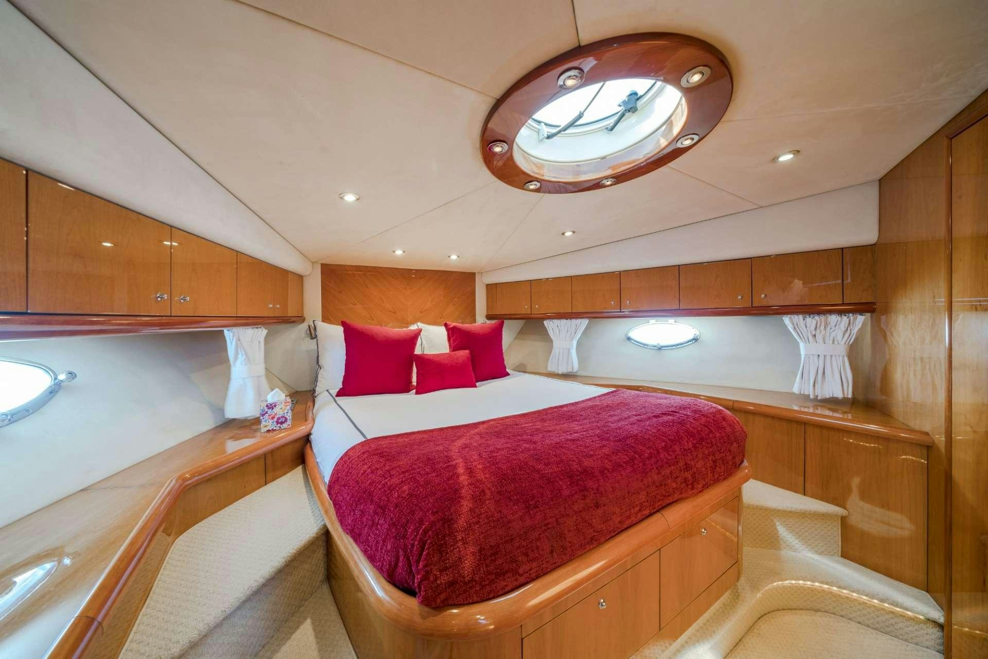 a bed in a room aboard REHAB Yacht for Charter