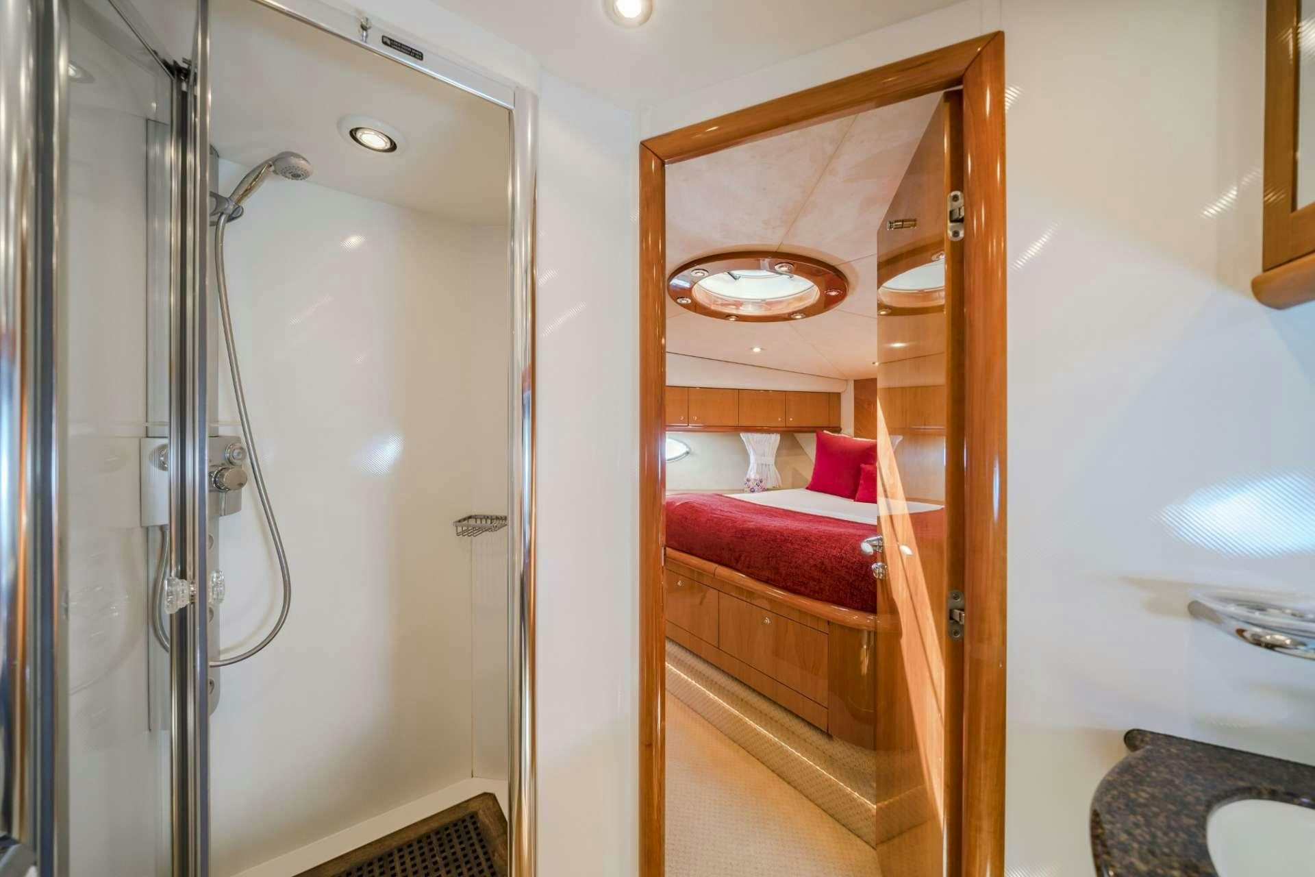 a bathroom with a glass shower aboard REHAB Yacht for Charter