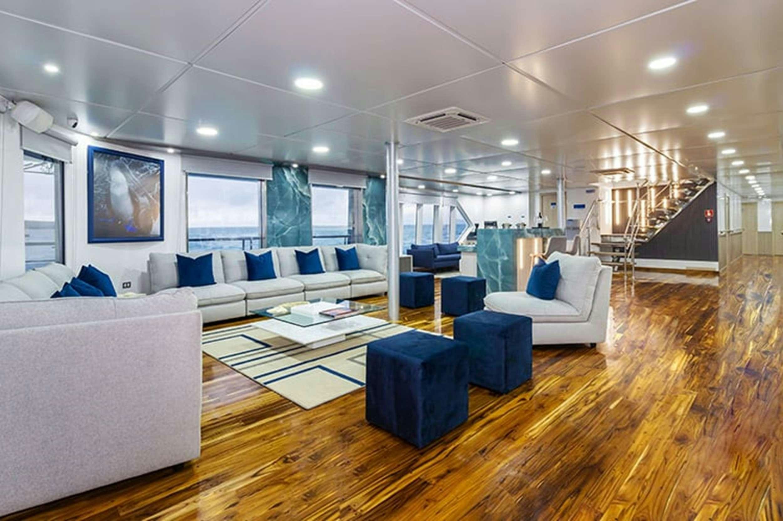 a living room with a large open floor plan aboard CORMORANT II Yacht for Charter