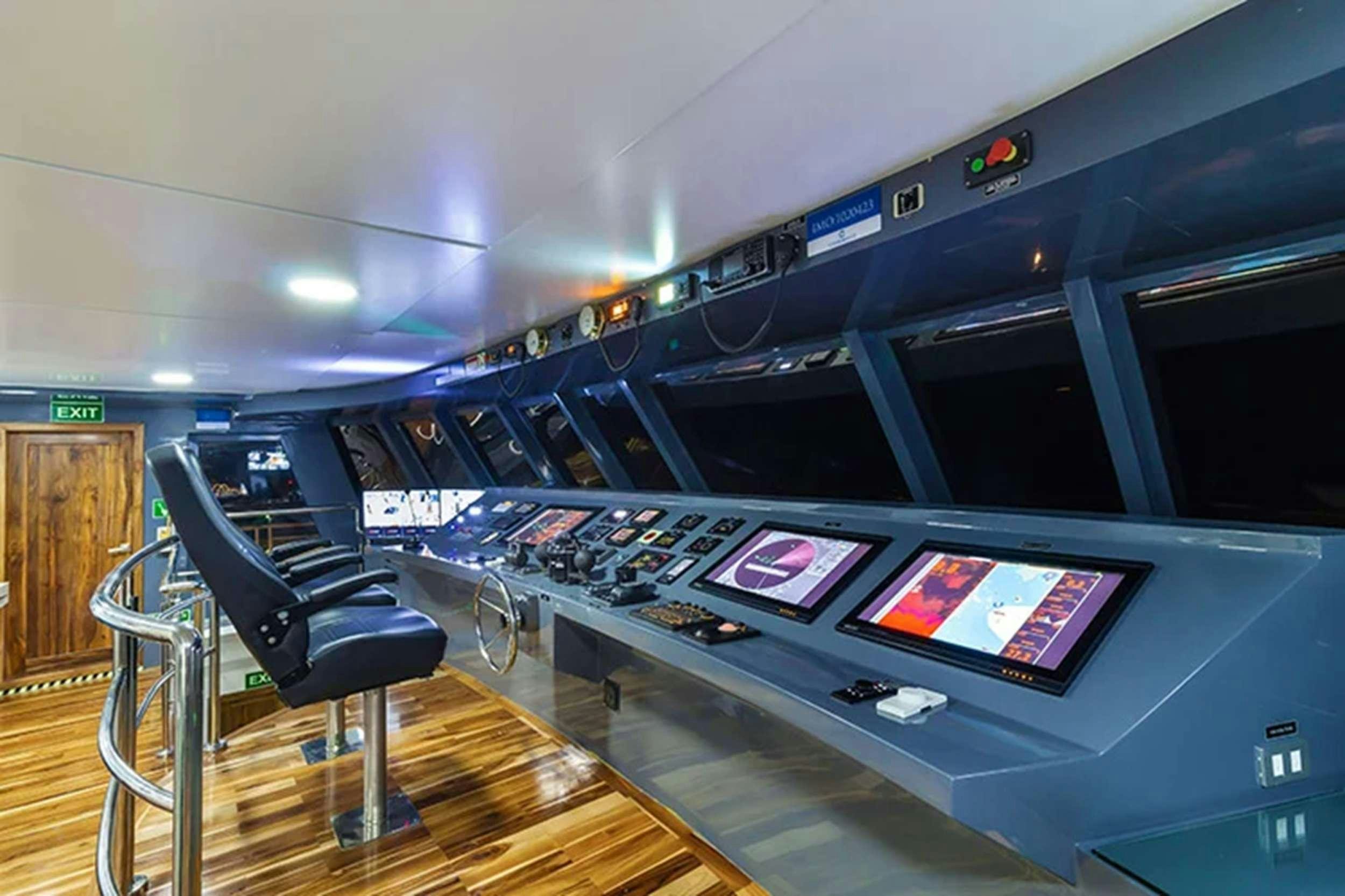 a room with a table and chairs aboard CORMORANT II Yacht for Charter