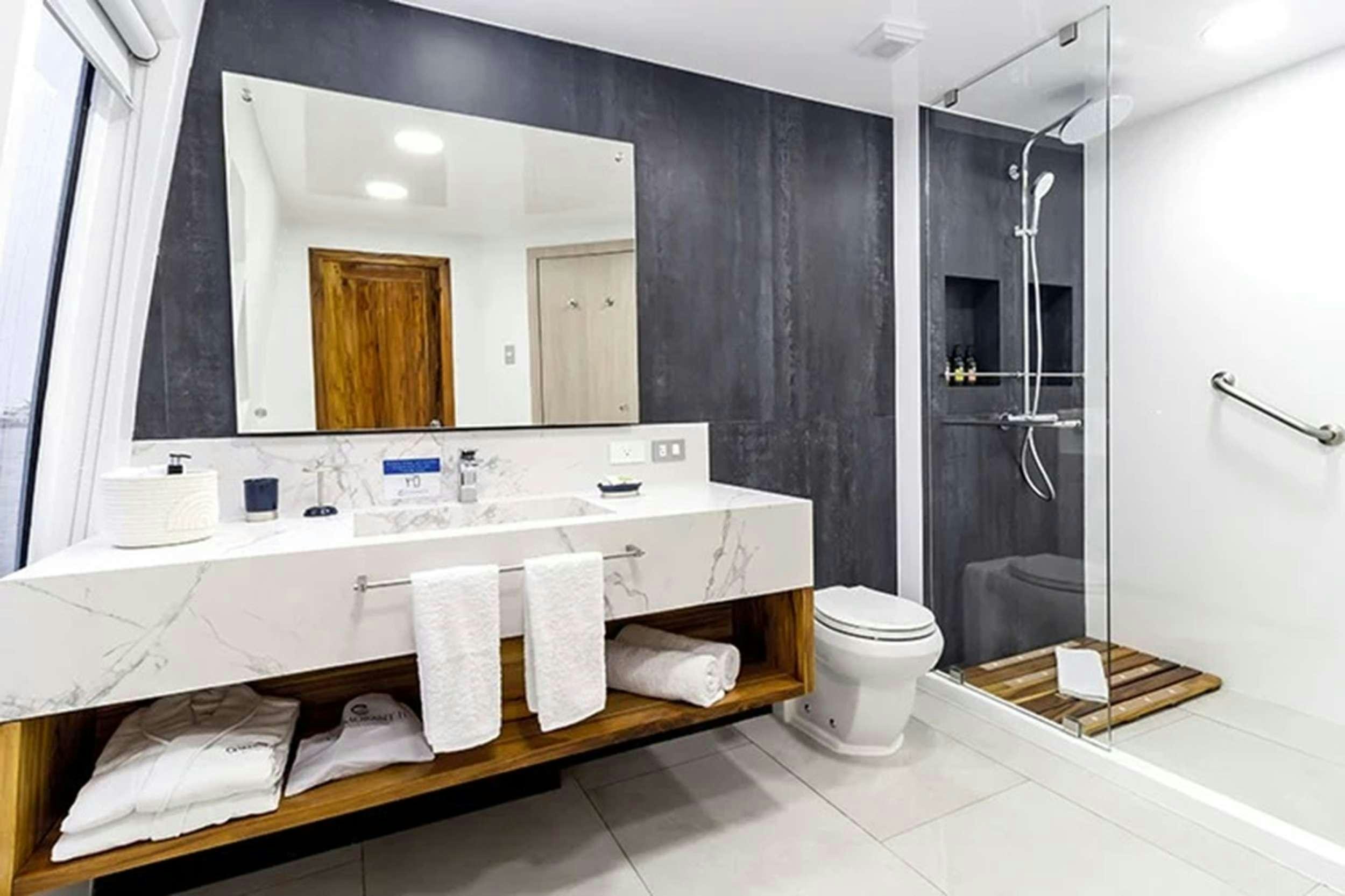 a bathroom with a large mirror aboard CORMORANT II Yacht for Charter