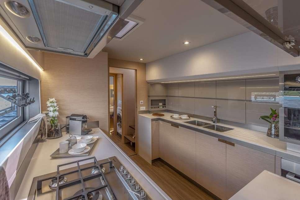 a kitchen with a countertop sink and cabinets aboard ALOIA  Yacht for Charter