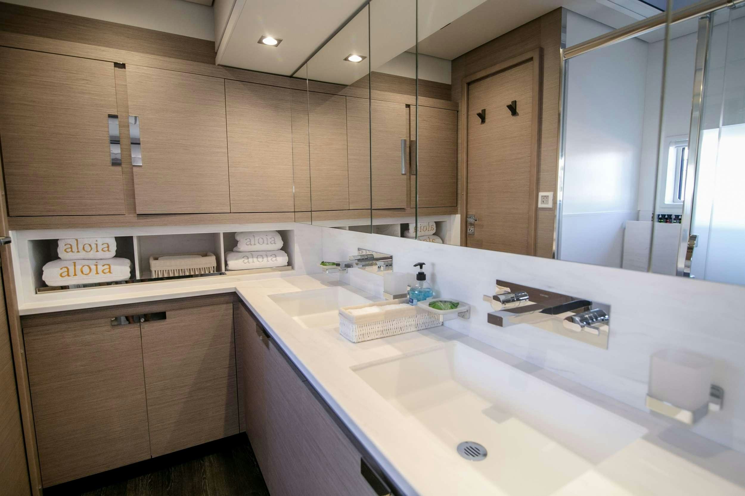 a kitchen with a countertop sink and cabinets aboard ALOIA  Yacht for Charter