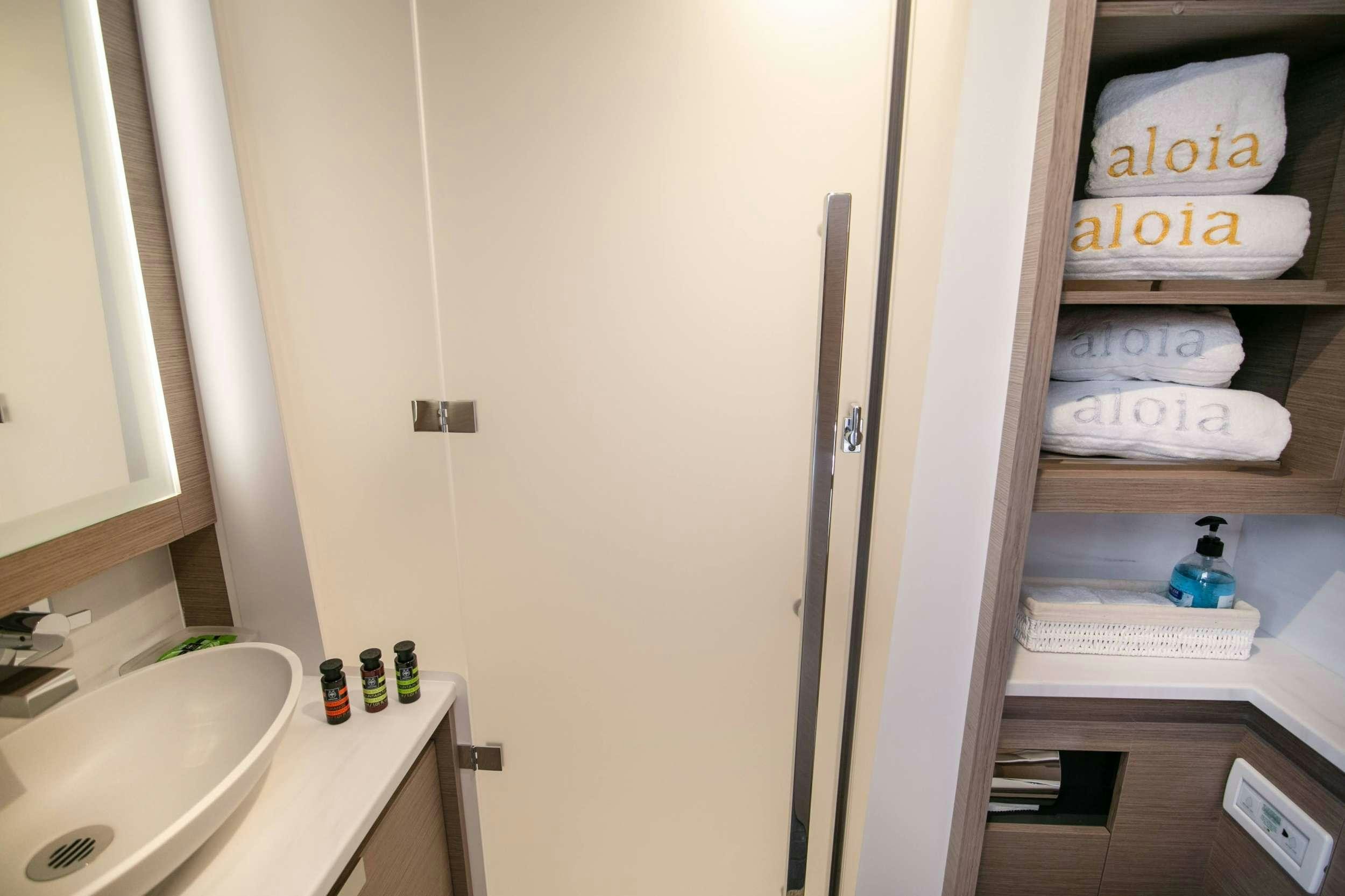 a white door with a white object on it aboard ALOIA  Yacht for Charter