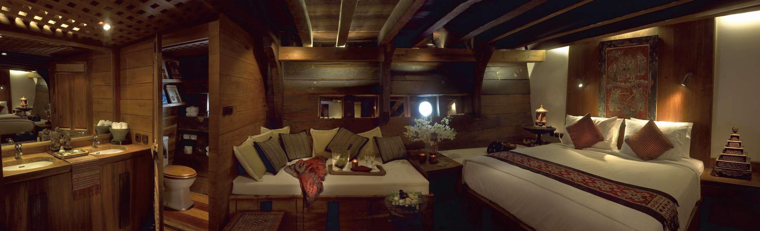 a room with a bed and a couch aboard SILOLONA Yacht for Charter