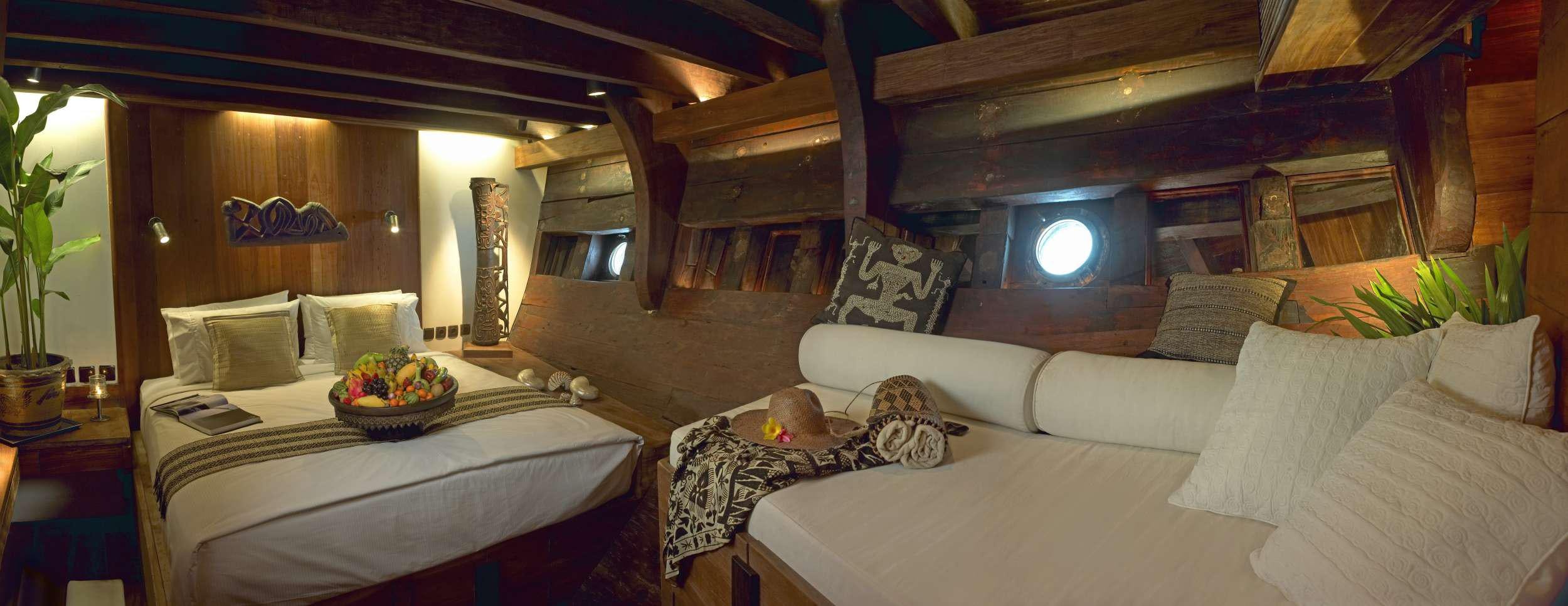 a couple of beds in a room aboard SILOLONA Yacht for Charter