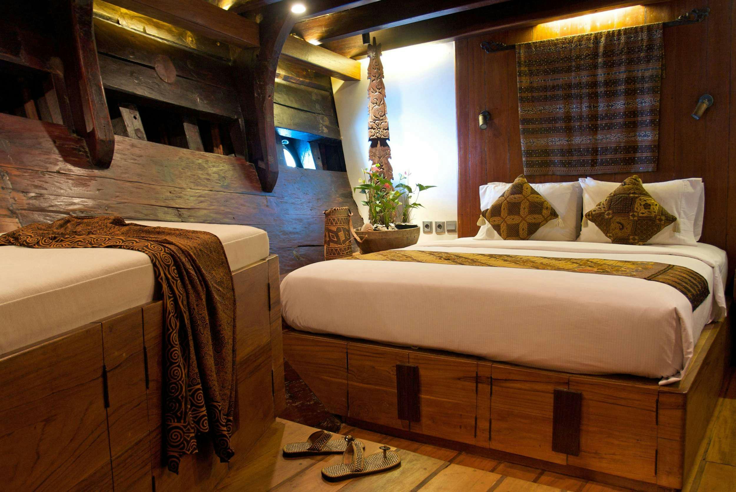 a room with two beds aboard SILOLONA Yacht for Charter