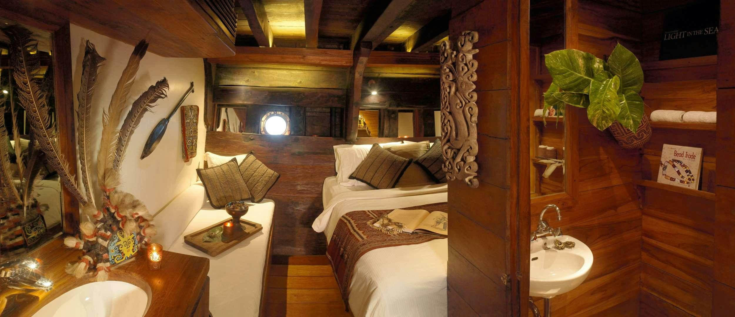 a room with a bed and a lamp aboard SILOLONA Yacht for Charter
