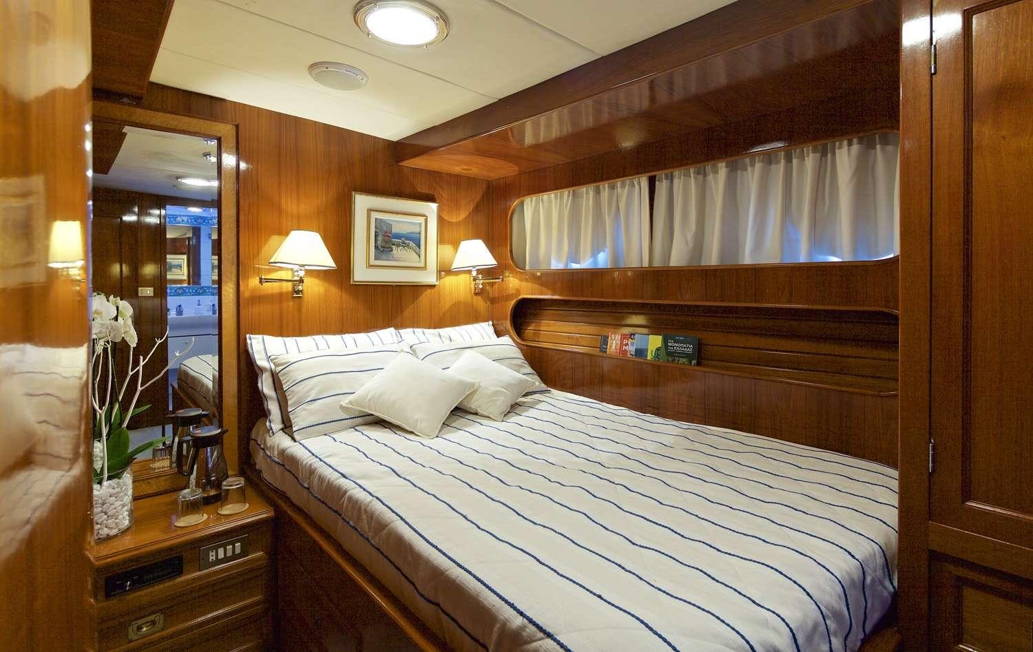 a bed in a hotel room aboard HERMINA Yacht for Charter