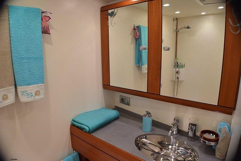 a bathroom with a sink and a mirror aboard TERRA DI MEZZO 3 Yacht for Charter