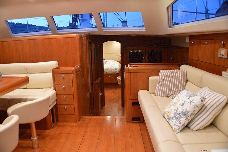 a room with a bed and a couch aboard TERRA DI MEZZO 3 Yacht for Charter