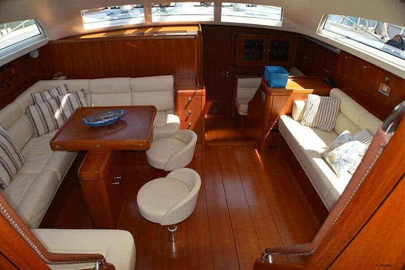 a living room with a couch and a table aboard TERRA DI MEZZO 3 Yacht for Charter