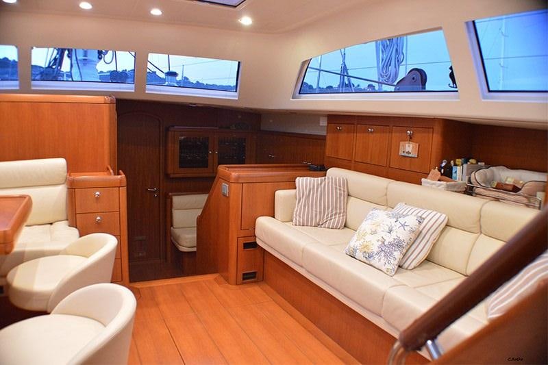 a living room with a couch and a tv aboard TERRA DI MEZZO 3 Yacht for Charter